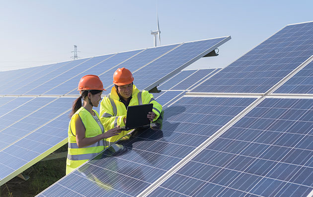 2 professionals installing solar panels