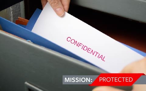 Confidential file being taken out of a drawer