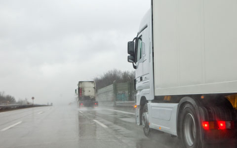 Truck driving in rainy conditions