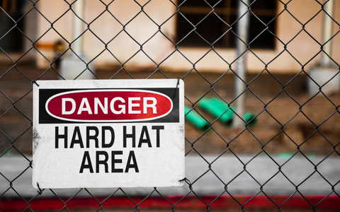 Hard hat area sign in front of construction site