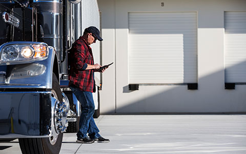 truck driver reviewing truck telematics