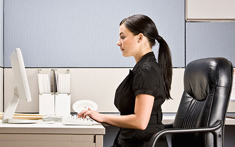 woman sitting ergonomically correct in chair