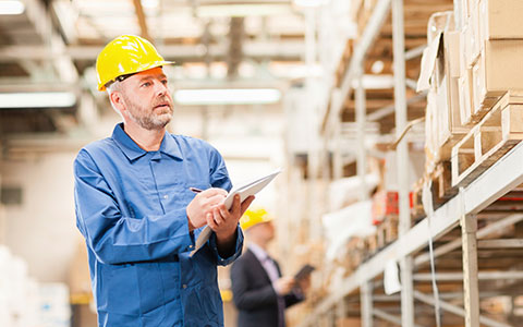 employee conducting inventory as part of supply chain management