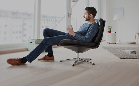 man sitting in chair at home